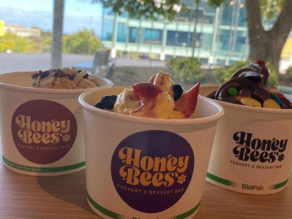 3 sample products places in front of the window with the plaza in the background